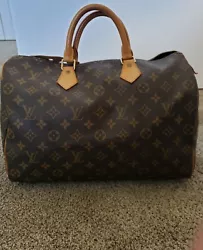 Louis Vuitton Speedy 35 Brown Canvas Monogram with lock and key. No Odor or Stains on the inside. Canvas is supple no...