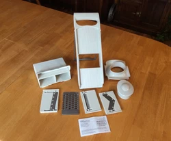 Pre Owned Pampered Chef Ultimate Mandoline #1087 4 Blades, Case, Stand,& Manual. Gentle used only a couple of times....