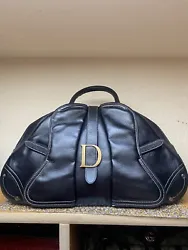 Beautiful black leather Dior double saddle bowling bag. In good condition with some flaws. Similar ones are selling for...