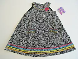 Adorable black and white sundress with multi-color details. Excellent quality - 4 buttons in back at neck.
