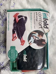 The booster seat is made by mifold and features a sleek grey color. It is designed to be used in forward-facing...