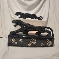 This vintage lamp is a unique addition to any collection. Featuring two fierce black panthers, they were made in Japan...