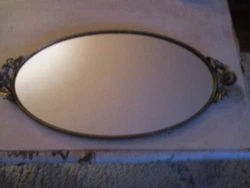 Antique circa 1930s boudoir mirror edged in brass with sunflower handles.  Back side is a burgandy velvet.  The...