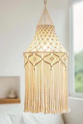 Add a touch of unique style to your living space with this Macrame Hanging Lampshade. Crafted with cotton rope and...