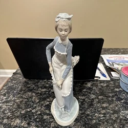 Nao Lladro, part of the name has been rubbed off. The item is in mint condition.  From a smoke free home.  No chips,...