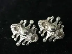 This set of rare signed Coro MCM brutalist silver tone clip on earrings are 1