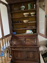 Burled walnut cylinder secretary desk/bookcase from late 1800s.In very good condition with key. A beautiful piece.