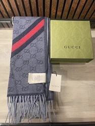 Elevate your style with this authentic Gucci GG Jacquard Pattern Wool Scarf. Crafted from high-quality wool, this...