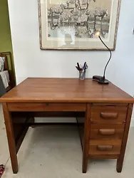 This vintage wood desk is a stylish and practical addition to any home or office. With a mid-century modern design and...