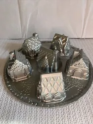 Nordic Ware Heavy Silver Color Cozy Village 6 Cups Pan. Very Good Used Condition. Very few minor scuffs and scrapes,...
