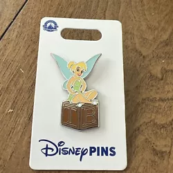 Disney Peter Pan Tinkerbell Sitting On Letter Block . Condition is New. Shipped with USPS Ground Advantage.