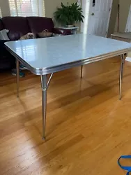 Grey 1950”s Formica and chrome kitchen table.  As is, missing the middle leaf.  35.5 in wide, 48 in long, 29.5 in...