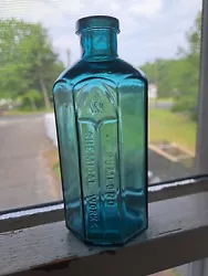ANTIQUE MEDICINEBOTTLE . The bottle is embossed with a W in the center of an arch then Rumford chemical works. It is a...