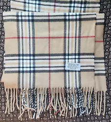 This elegant fringed scarf is a designer-inspired delight! Beige plaid with fringe, the scarf is 100-percent acrylic...