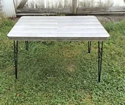 Here is a neat little Mid-Century Formica kitchen table. The legs have just been repainted and the mounting solidified....
