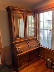 Note: The overall height of this desk and bookcase is 95” tall. This is an original two-piece walnut secretary desk...