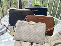 CROSSBODY BAG. STYLE: EW CROSSBODY. This east west crossbody bag features; Black, Vanilla, Powder Blush and Many More....