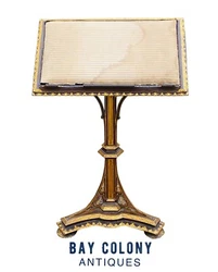 This example has a cushioned surface which is ideal to support old leather or paper covers. The work surface has...