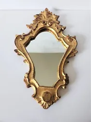 In very nice condition, there is a cloudy spot on the mirror.