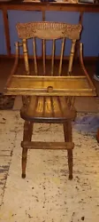 This antique wooden high chair is a beautiful piece of furniture that is perfect for any family with a young child. The...