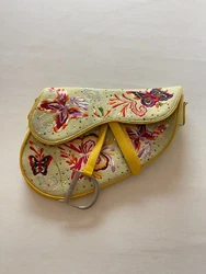 Authentic Dior Yellow Saddle Bag. The strap was cut to be used as clutch and do not have the strap anymore.