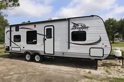 This is a super well maintained 2015 Jayco SLX 264BHW Bunk House Travel Trailer RV. This RV has 2 massive bunk beds, a...
