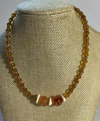 Amber Tone and Cream Small Beads with 2 Large marble like beads and 3 Triangle Cream Colored.