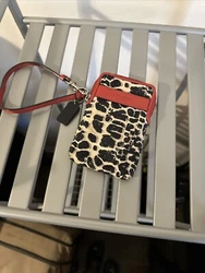 COACH OCELOT TECH PHONE CIGARETTE WRISTLET.