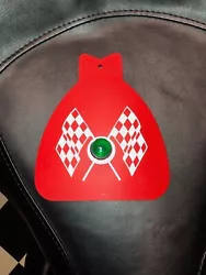 MUDFLAP IN RED WITH RED & WHITE CHECKERED CROSS FLAGS AND GREEN JEWEL. YOU GET ONE MUDFLAP IN RED. WITH CHECKERED CROSS...