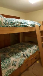 Twin Size Bunk Beds. With book shelves on both ends and 3 draw storage underneath.  Mattresses not included