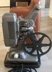 Revere 8mm Movie Projector Model P-90 W/ Case And Reel. Lamp & Motor Work. When plugged in everything runs well....