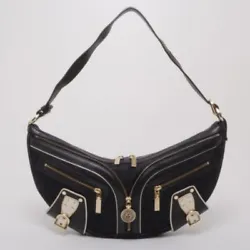 This black biker bag by Versace is just what you need to create an edgy. The interior is lined with black textile and...
