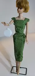 I have not washed this dress. BARBIE DOLL AND STAND ARE NOT INCLUDED IN THIS SALE. FLAW: THE HEM NEEDS TO BE...