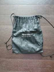 Hennessy Drawstring Backpack. Hole as pictured at the bottom of bag. Preloved