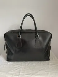 Prada Saffiano Travel Briefcase In Nero. This bag is gorgeous! In overall decent condition, saffiano has some minor...
