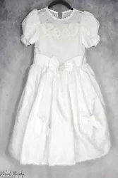 This is a tea-length dress that would be perfect for First Communion, a wedding, or any dress up occasion. The dress is...