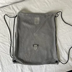 Strong mesh. Gray on one side, black on the other. Size is roughly 15 inches wide and 17 inches tall