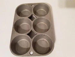 A vintage cast aluminum muffin pan marked A-2 in good, used condition. Check the pics.