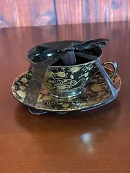 This Elegance tea cup and saucer set is perfect for Halloween with its gothic style and skull and rose theme. its...
