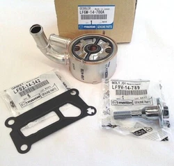 LF6W-14-700A GENUINE UPDATED OIL COOLER AND SEAL. LF9V-14-789 BOLT REQUIRED TO USE UPDATED COOLER. LF02-14-342 OIL...