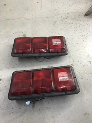 Pair of used starcraft pop up camper taillights. one lens has two cracks in it, the other one has none. bulbs were not...