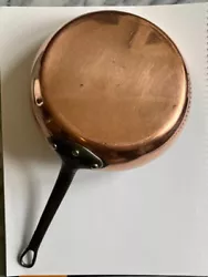 There is a small but noticeable dent and scratch on the surface of the pan (circled in photo). This could possibly be...