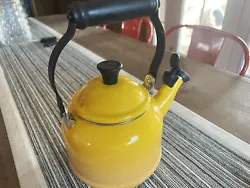 Le Creuset Enameled Steel 1.7-Quart Sun Yellow Tea Kettle Whistle needs tiny bit of cleaning at bottom. Very small ding...