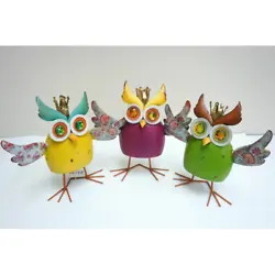 Each owl has its wings spread out wide and balances on its feet. Hand crafted and painted. Hand Painted. Hand and...