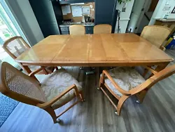 From the Broyhill Premier collection, this is a solid burled ash dining table with 6 chairs and a combination...
