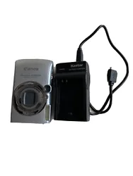 canon powershot sd890 is digital ELPH and Kastar battery charger.