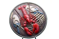 Add a touch of nautical charm to your home with this colorful Lobster wall plaque. Crafted from durable resin, this...