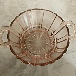 Very pretty decorative depression glass bowl/candy dish with applied handles. Lovely peach color.