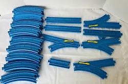 Lot 45 Pieces Blue Tomy Thomas the Train Track Straight Curved Switches. In used condition. Lot includes 37 curbed...