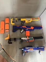 Lot of 4 used nerf guns, magazines, barrel extensions, stocks. The yellow one and the blue Rampage one struggle to...